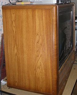 A cabinet with veneer wood paneling