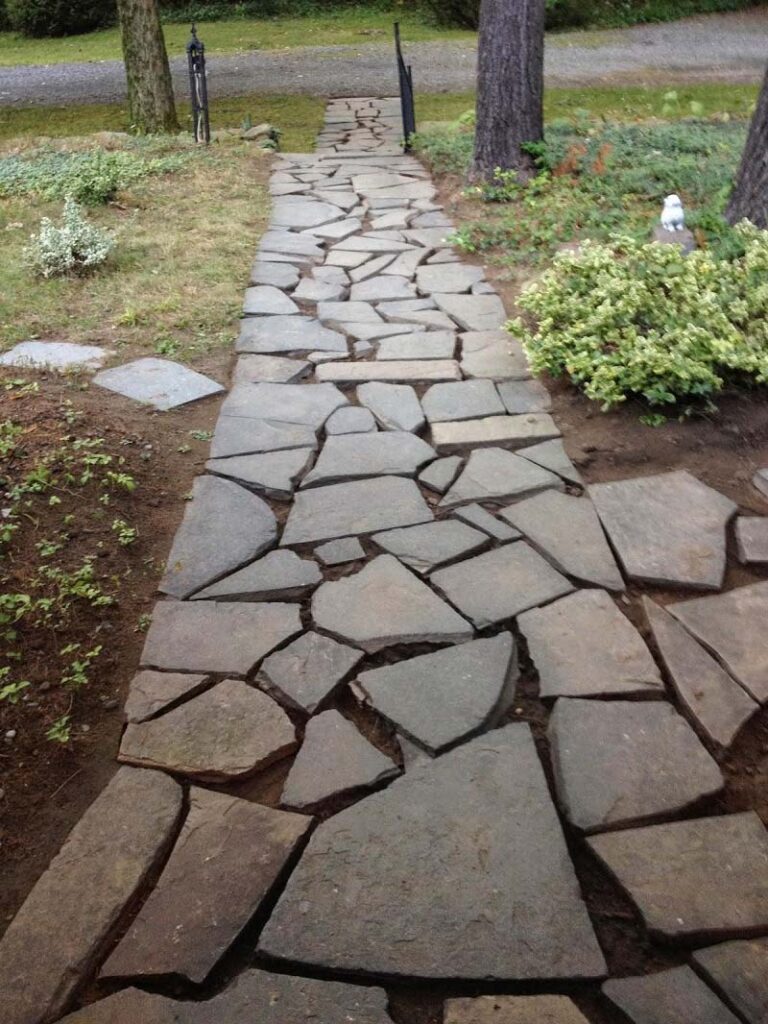 Using flagstones to fix muddy backyard dog trail  