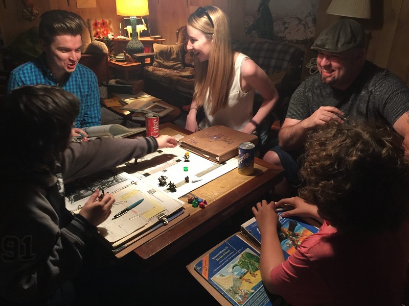 Kids playing Dungeons and Dragons in a basement