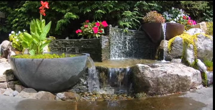A pondless water garden with ribbed wall design. 