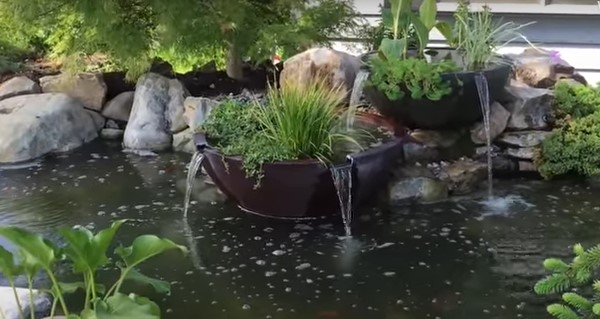 Two-tiered patio bowls serving as the fountain accessory.