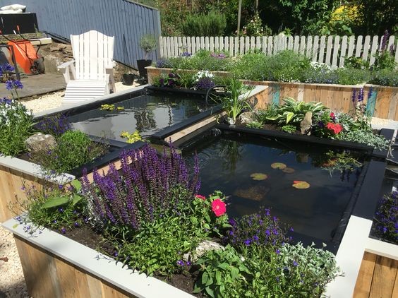 A medium-sized hybrid water garden built with a liner and wooden pillars for structure and stability. 