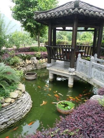 A mini pagoda for a small dining area 
surrounded by a koi pond.
