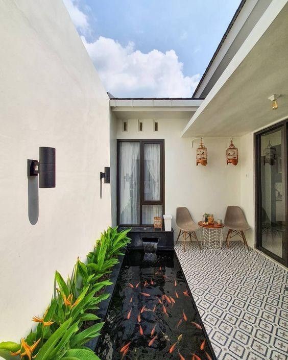 A simple pocket koi pond in a modernly designed balcony.