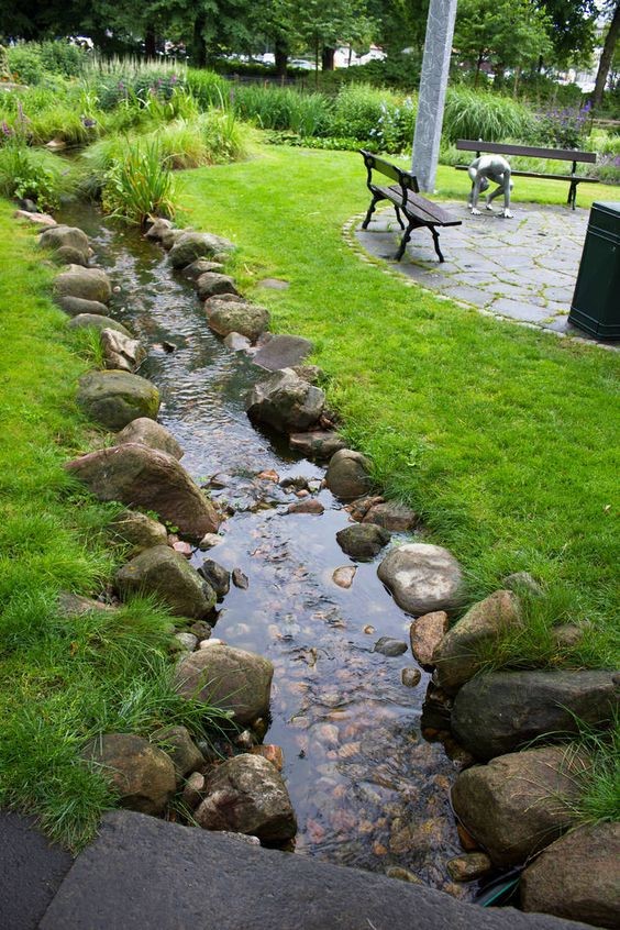  A stream-like koi pond in a backyard.