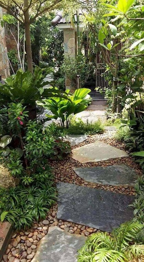 A bluestone pathway dry-laid in a small garden.