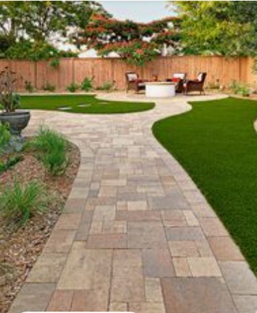 A garden pathway that has a curved layout.
