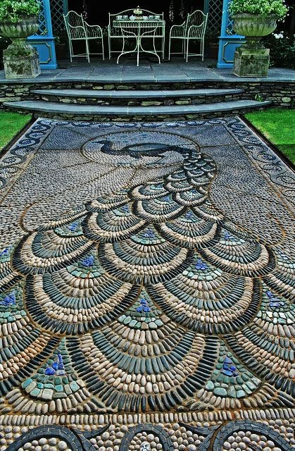 A garden pathway that served as a work of art showcasing the beautiful feathers of a peacock. 