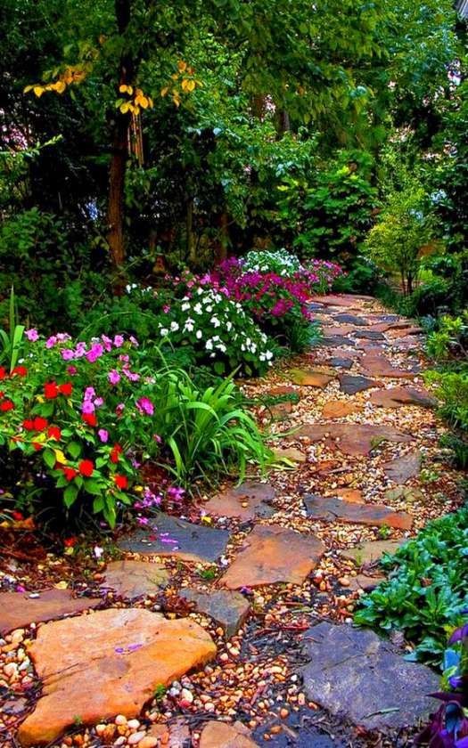 A colorful pathway blending the orange-colored flags stones, bluestones, and multi-colored pebbles.