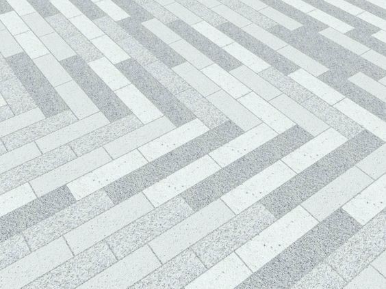 A light-colored pathway designed with monochromatic shades of gray.