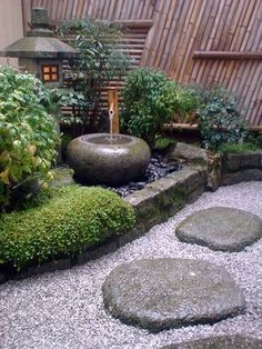 A Japanese garden that uses rounded and flat river rocks as stepping stones.
