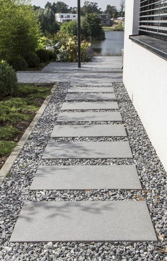 A pathway with modern design at the side of the house.