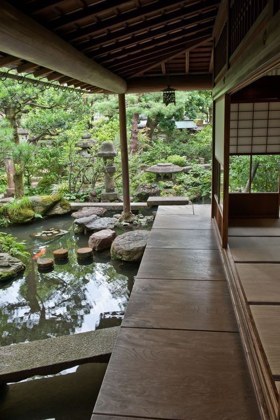 A Japanese garden directly accessible to the main house. The koi pond is surrounded by bonsai trees, rock walkways, and some pagodas.