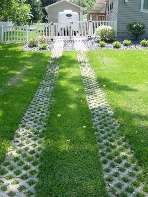 A path intended for vehicles designed with criss-cross turf stone.