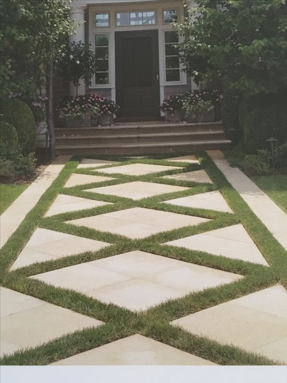 An elegant-looking stone and turf pathway design.