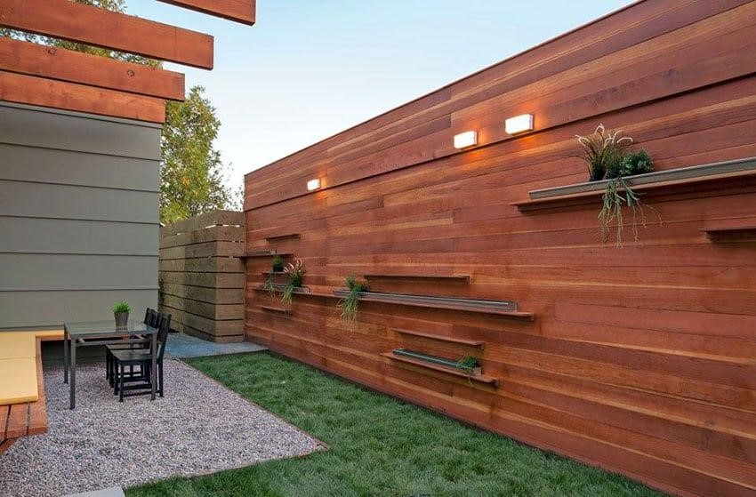 Fence planter boxes in a contemporary designed wall.