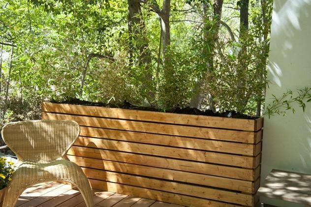 Tall and narrow fence planter boxes.