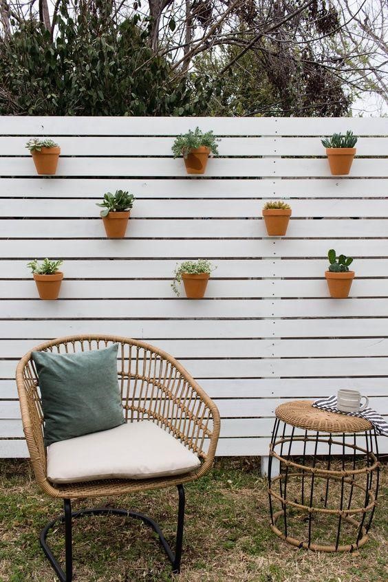 Terracotta fence planters.