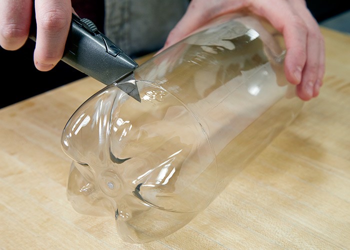 cut a 2-liter or 1-liter soda bottle at the bottom
